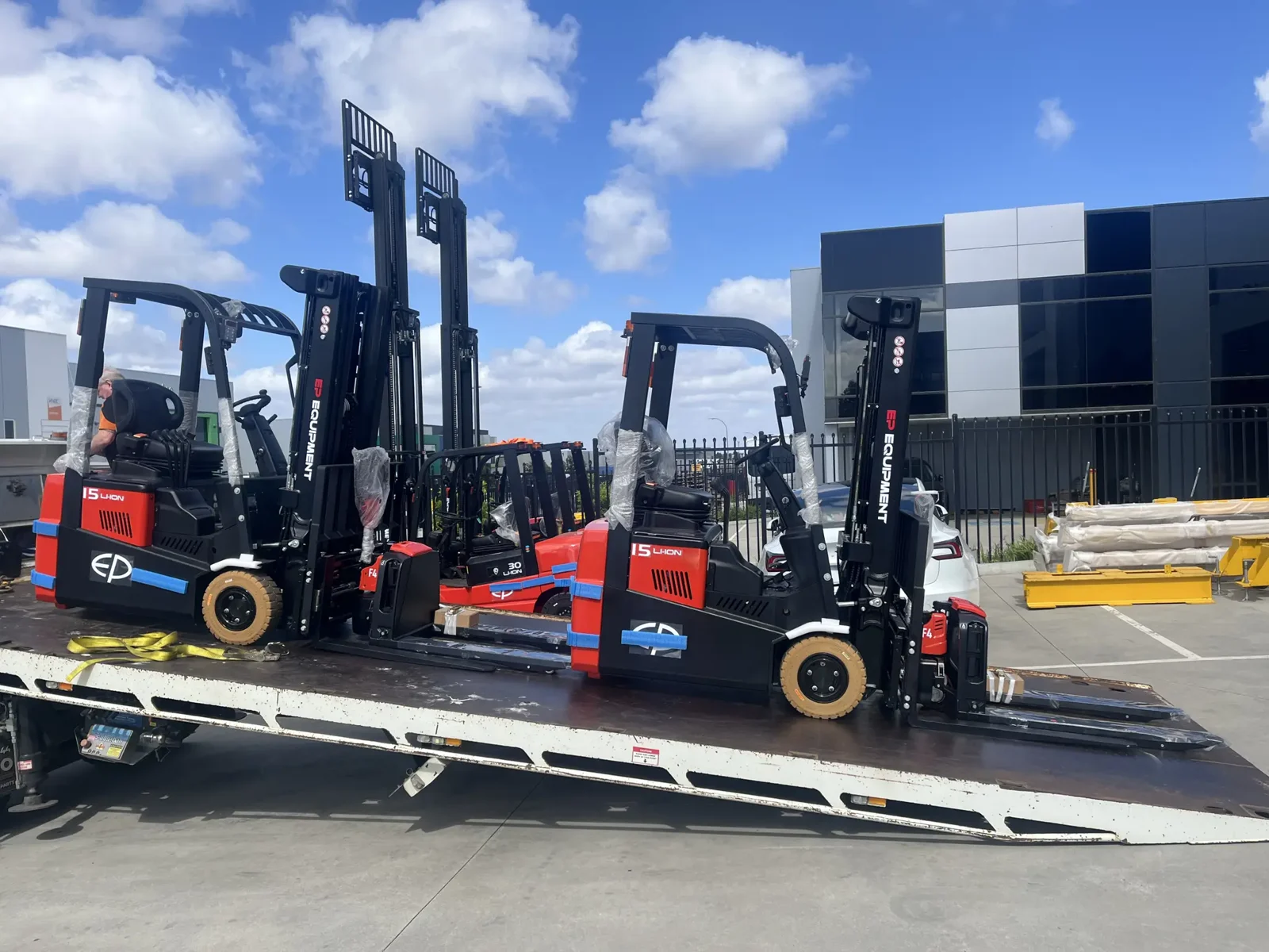 EP lithium forklifts being delivered by tilt-tray truck in Melbourne
